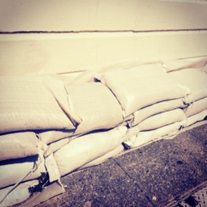 Contaminated sandbags continue to sit outside homes. These have been here since 12-03-14. SFPUC's number one suggestion to help residents: sandbag distribution.